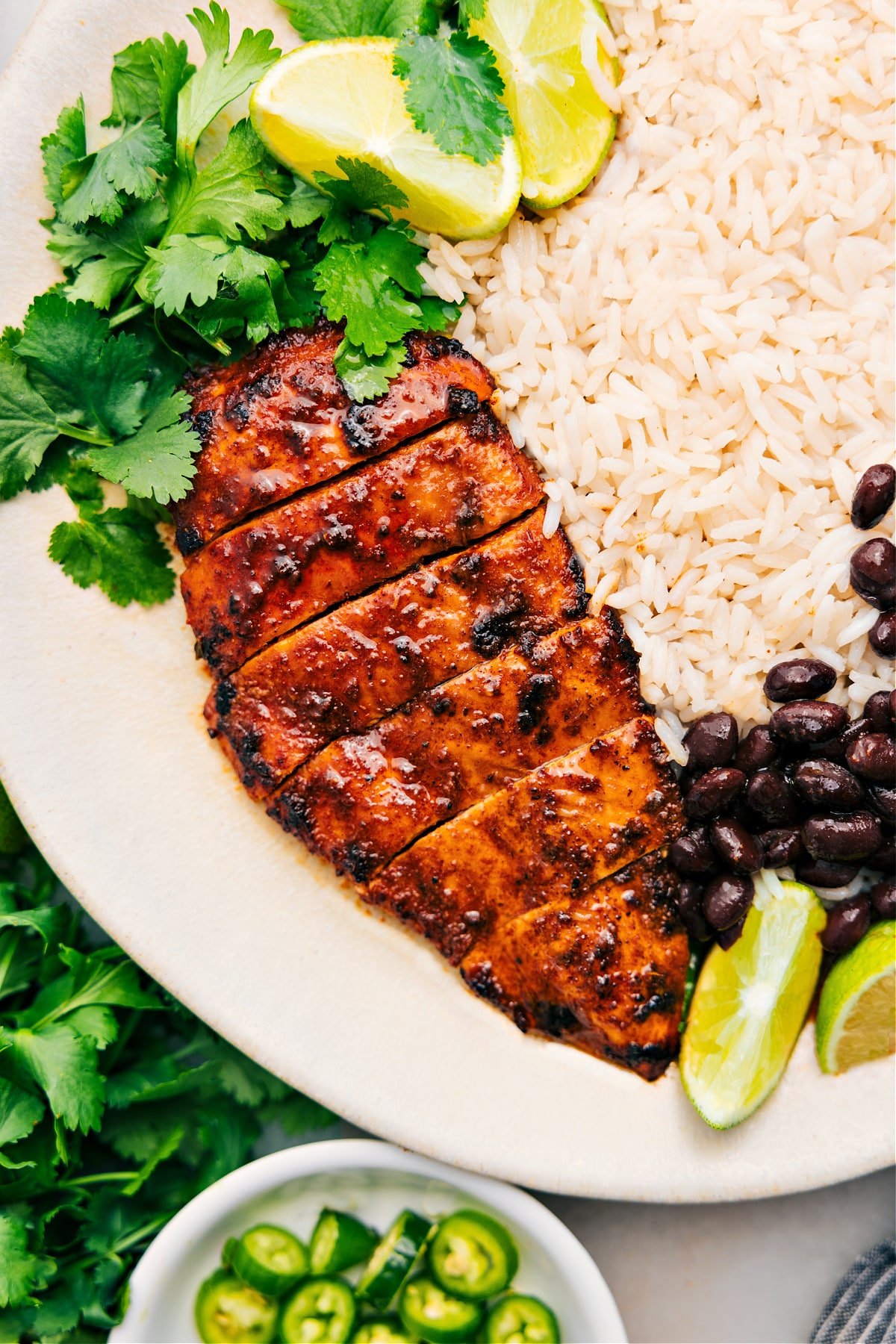 The Best Southwest Chicken Recipe Southwest Chicken on a plate with rice and beans.