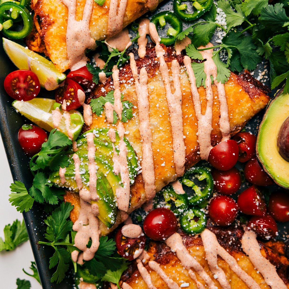 The dish fresh out of the oven, topped with all the toppings and drizzled with dressing, ready to be enjoyed.