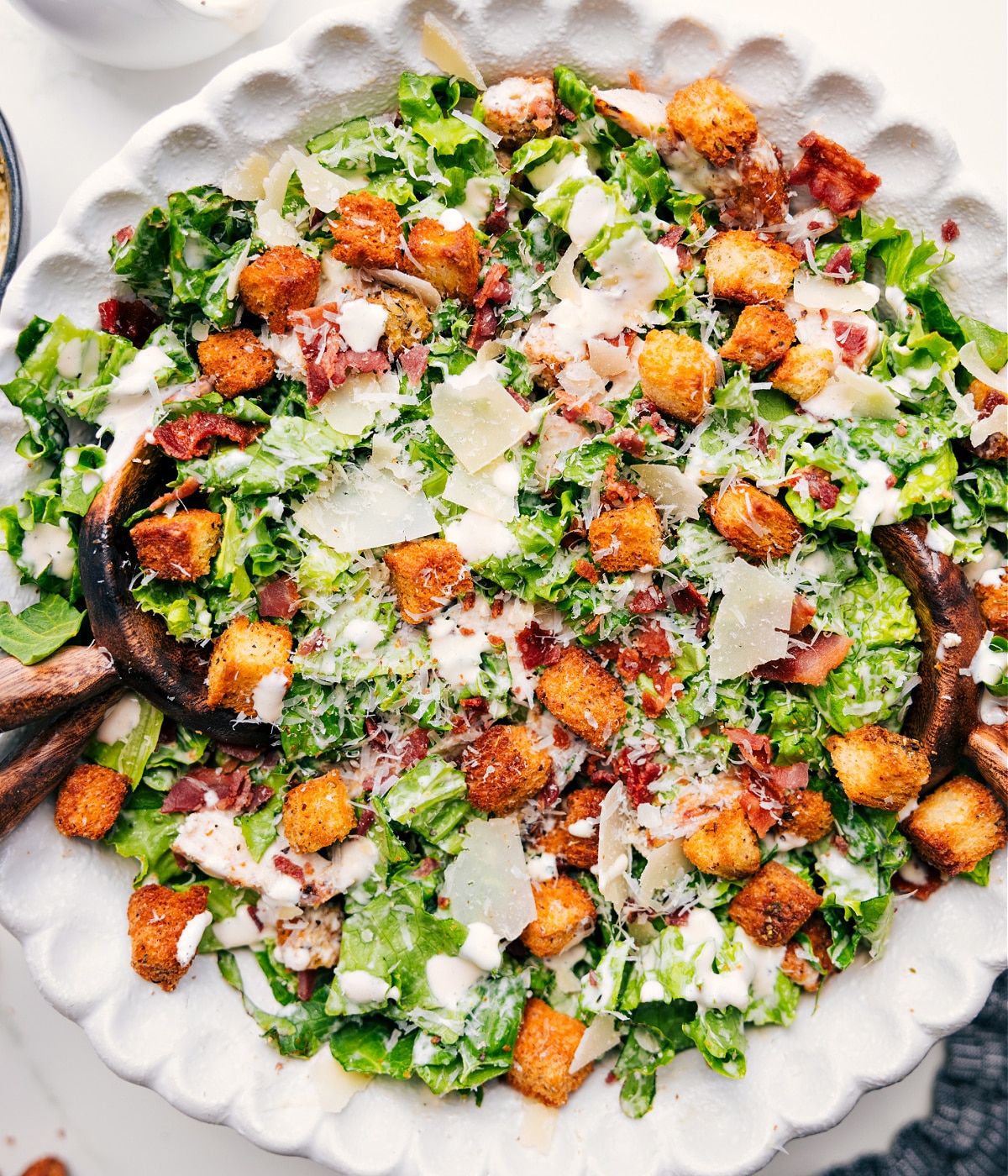 A salad tossed with the dressing and topped with all the delicious extras for a satisfying dinner.