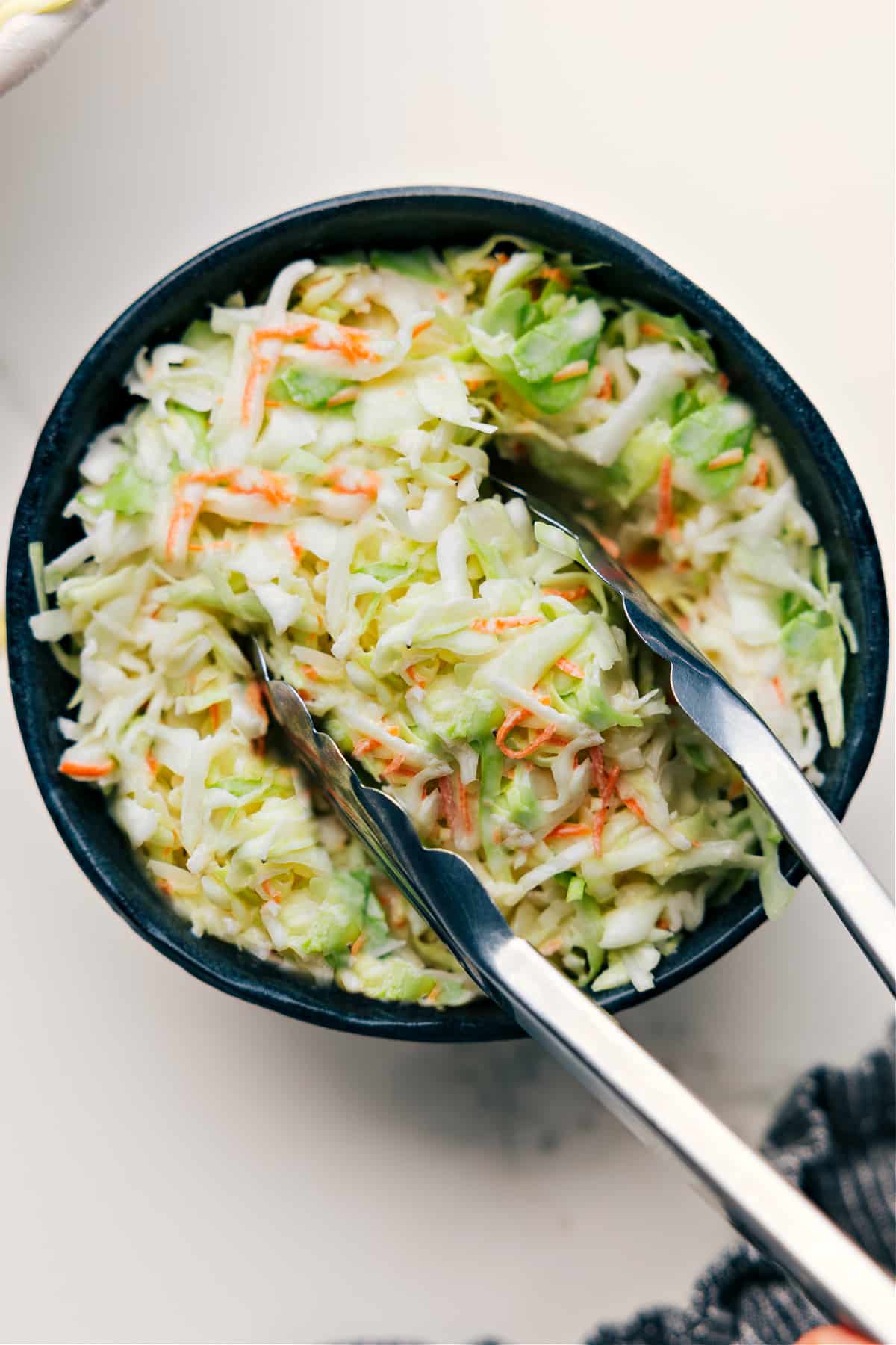 The Best Copycat Chick-Fil-A Coleslaw Recipe Chick-Fil-A Coleslaw Copycat Recipe served in a bowl.