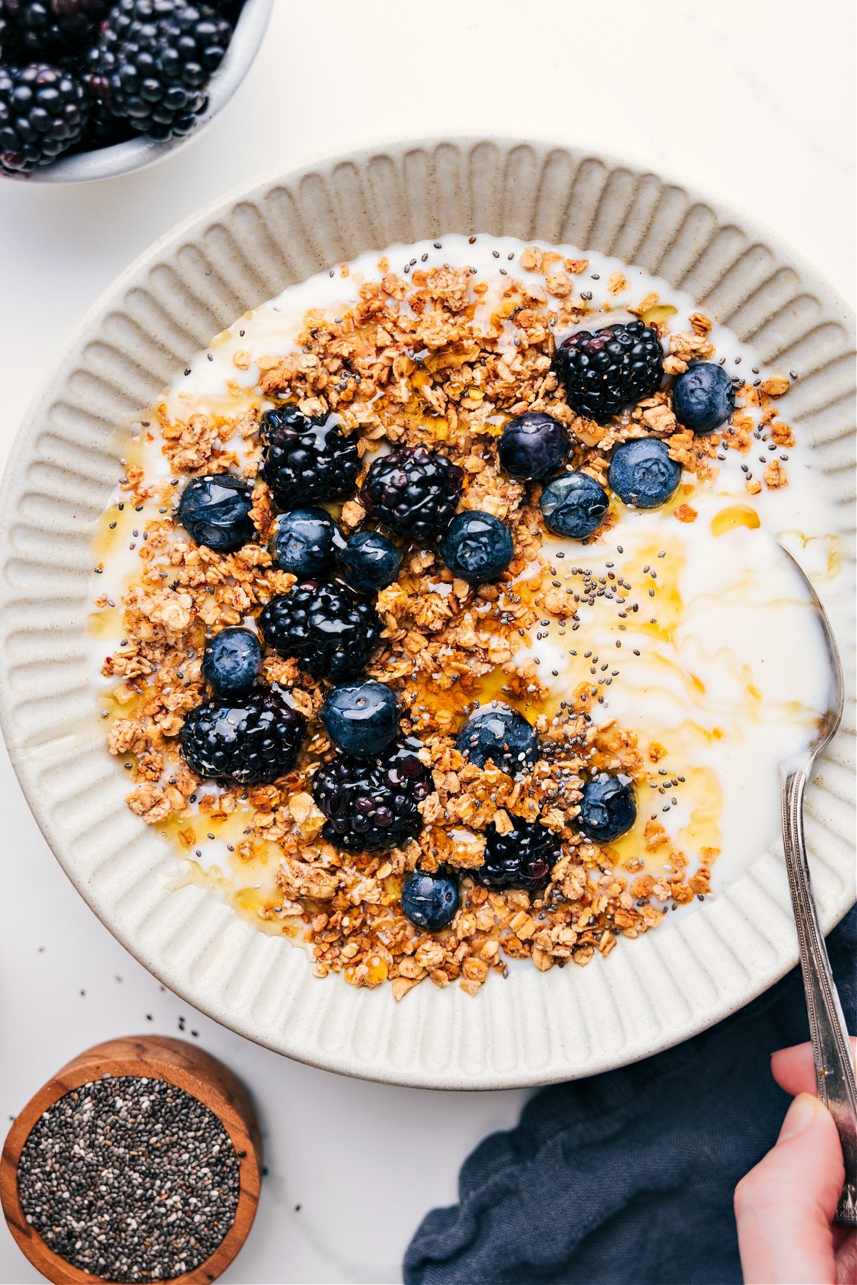 Easy Homemade Granola Recipe Easy Homemade Granola Recipe over yogurt with fresh berries.