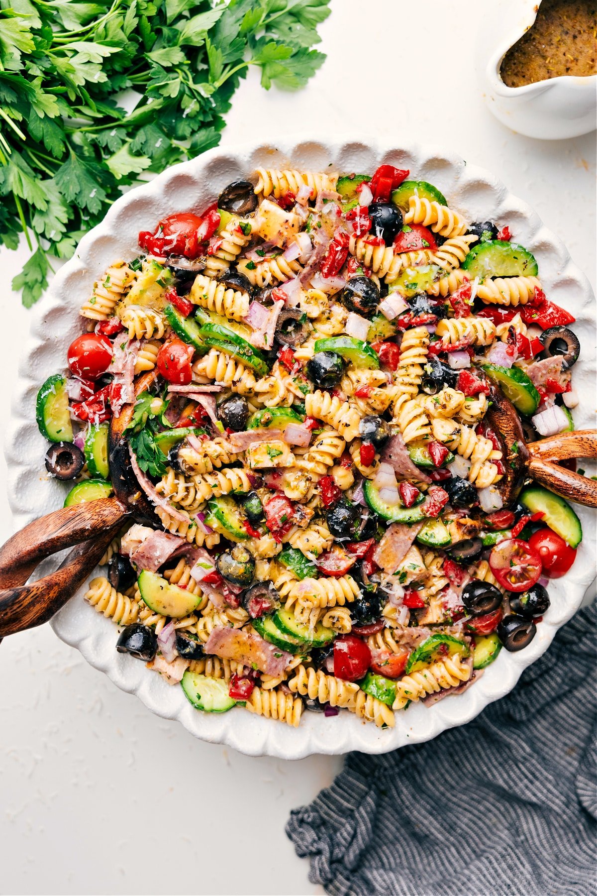 Italian Pasta Salad Recipe Is The Dish Of The Summer Italian Pasta Salad Recipe served in a bowl with fresh veggies and dressing.