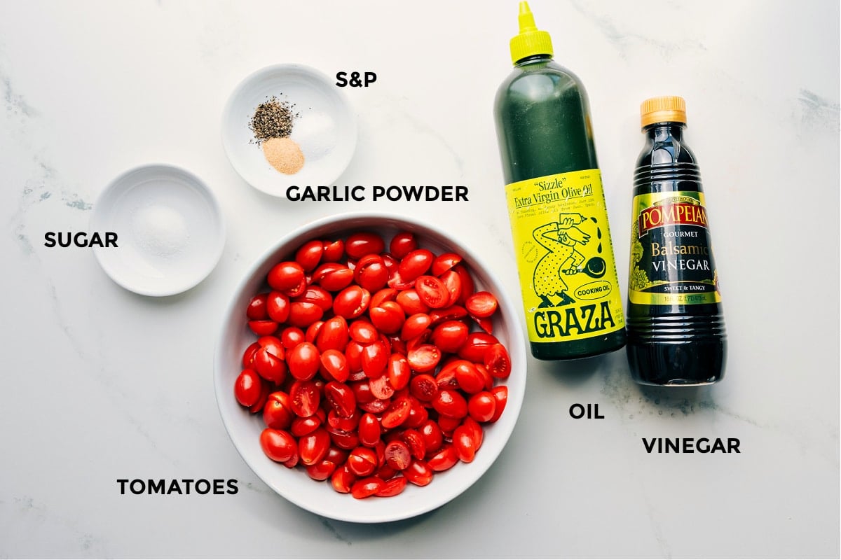 All the ingredients in this recipe prepped for easy assembly, including sugar, seasonings, tomatoes, olive oil, and vinegar.