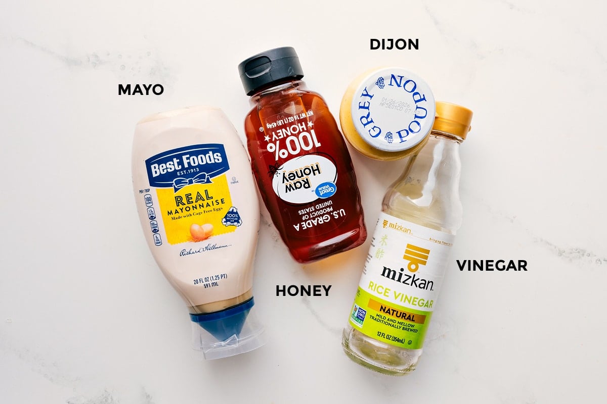 The dressing ingredients for Asian Slaw Recipe prepped out for easy assembly including the mayo, honey, dijon, and vinegar.
