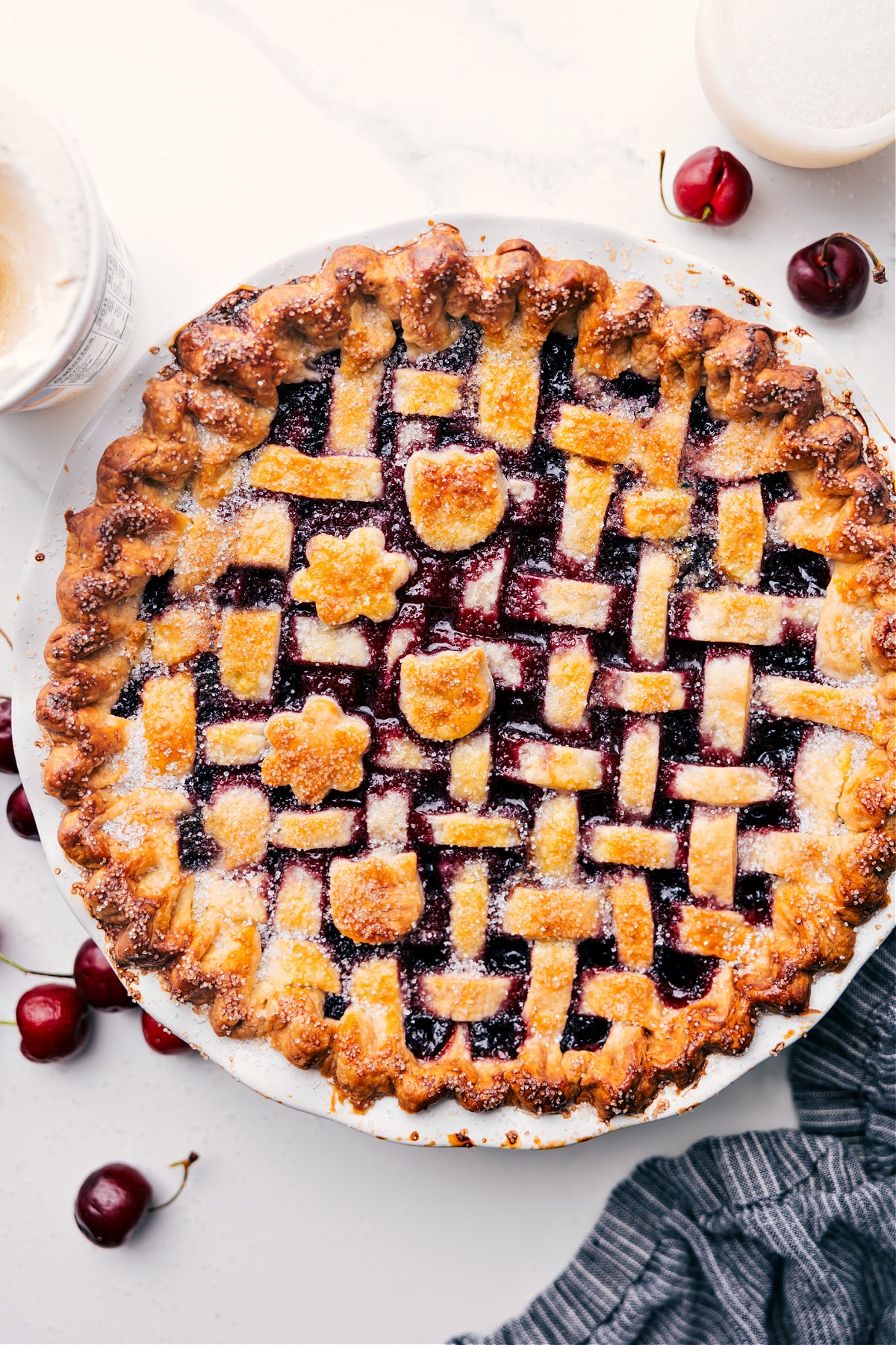 Golden-brown cherry pie recipe just out of the oven, waiting to be cut.
