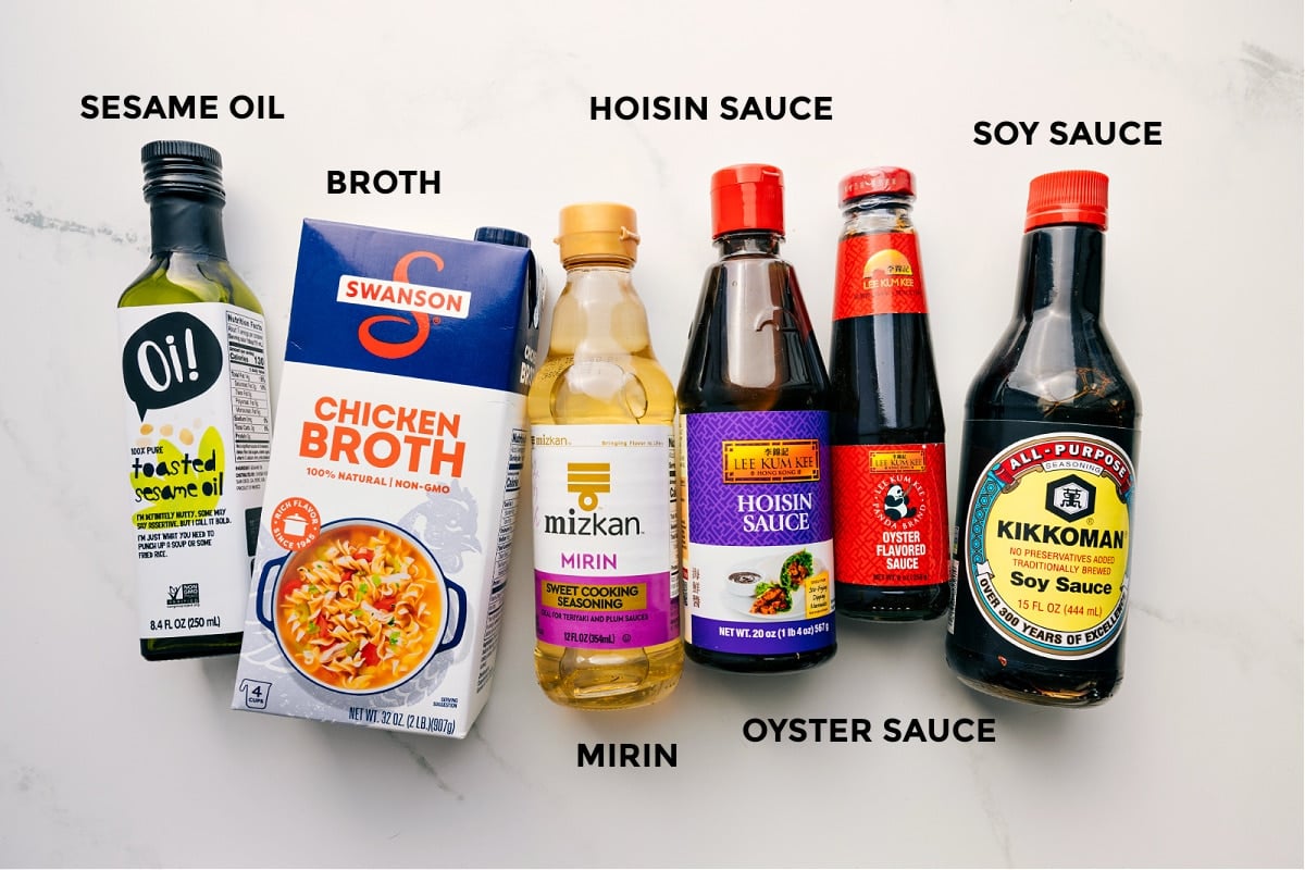 The sauce ingredients prepped out for easy assembly including the sesame oil, broth, hoisin sauce, mirin, oyster sauce, and soy sauce.