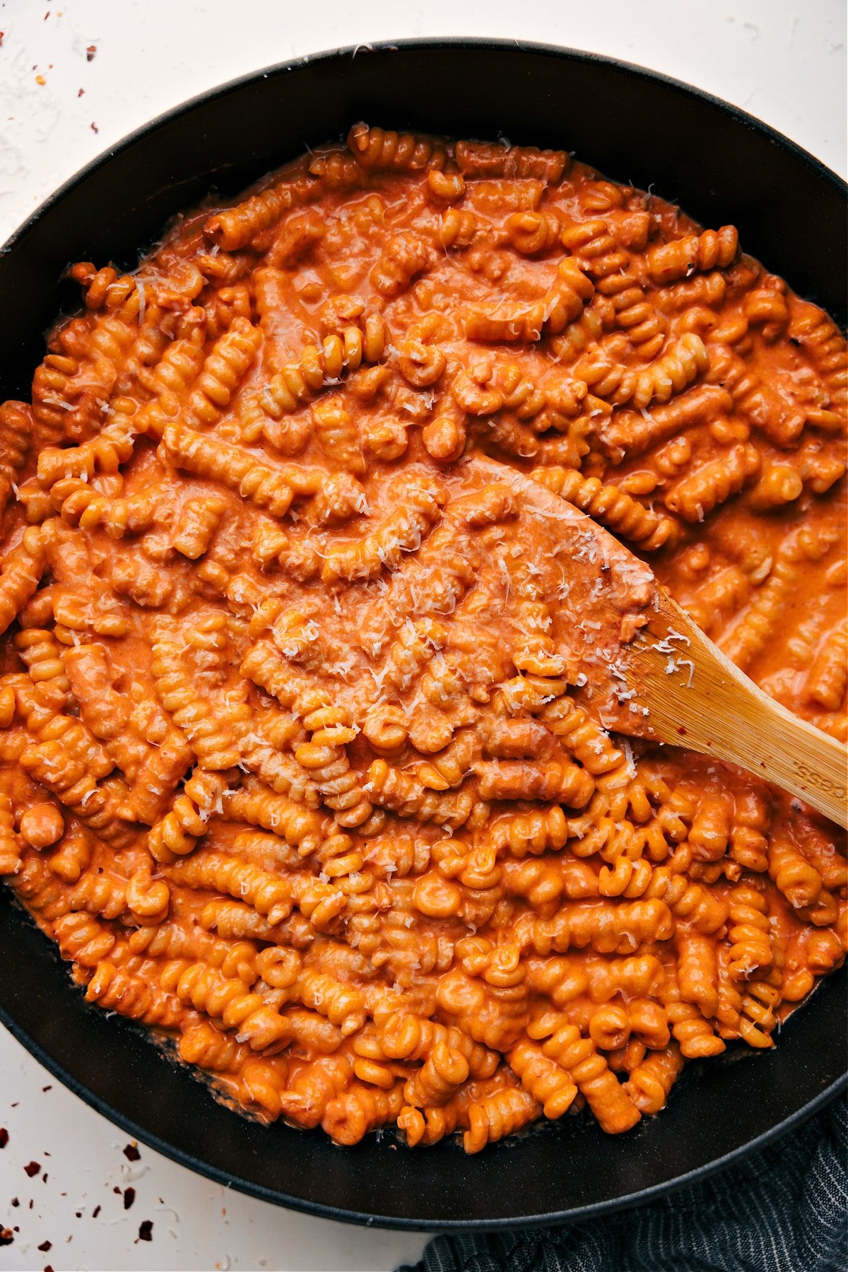Creamy tomato pasta topped with fresh Parmesan cheese.