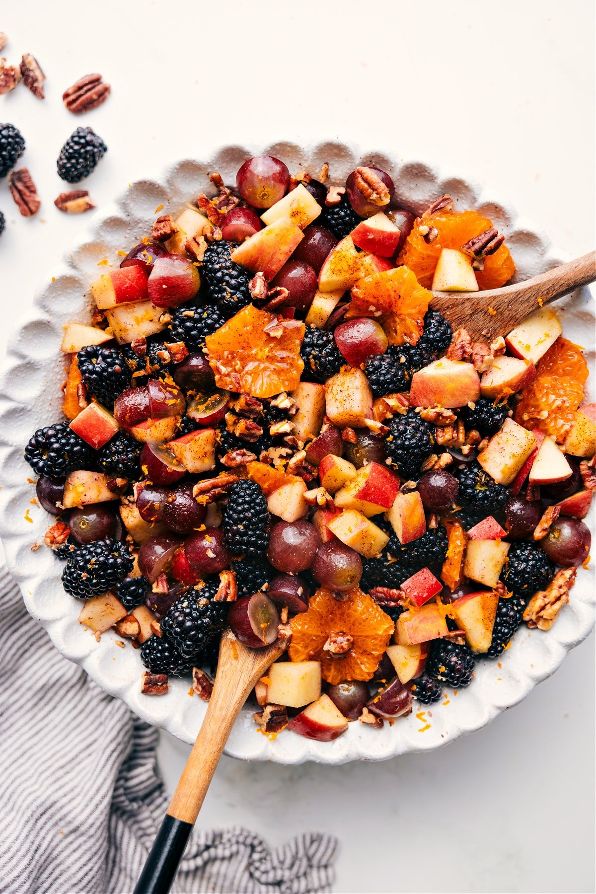 Fall Fruit Salad in a large bowl tossed with sweet dressing, ready to be served and enjoyed.