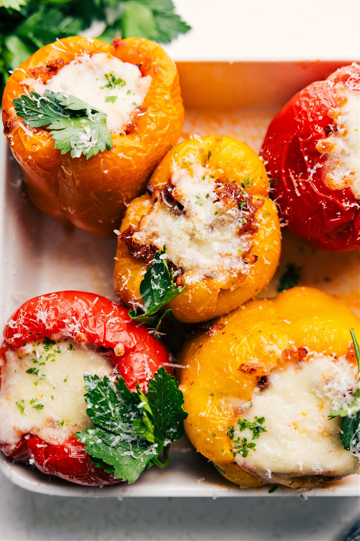 Italian Stuffed Peppers Are The Best Low-Carb Dinner Italian stuffed peppers baked in a casserole dish, ready to be served.