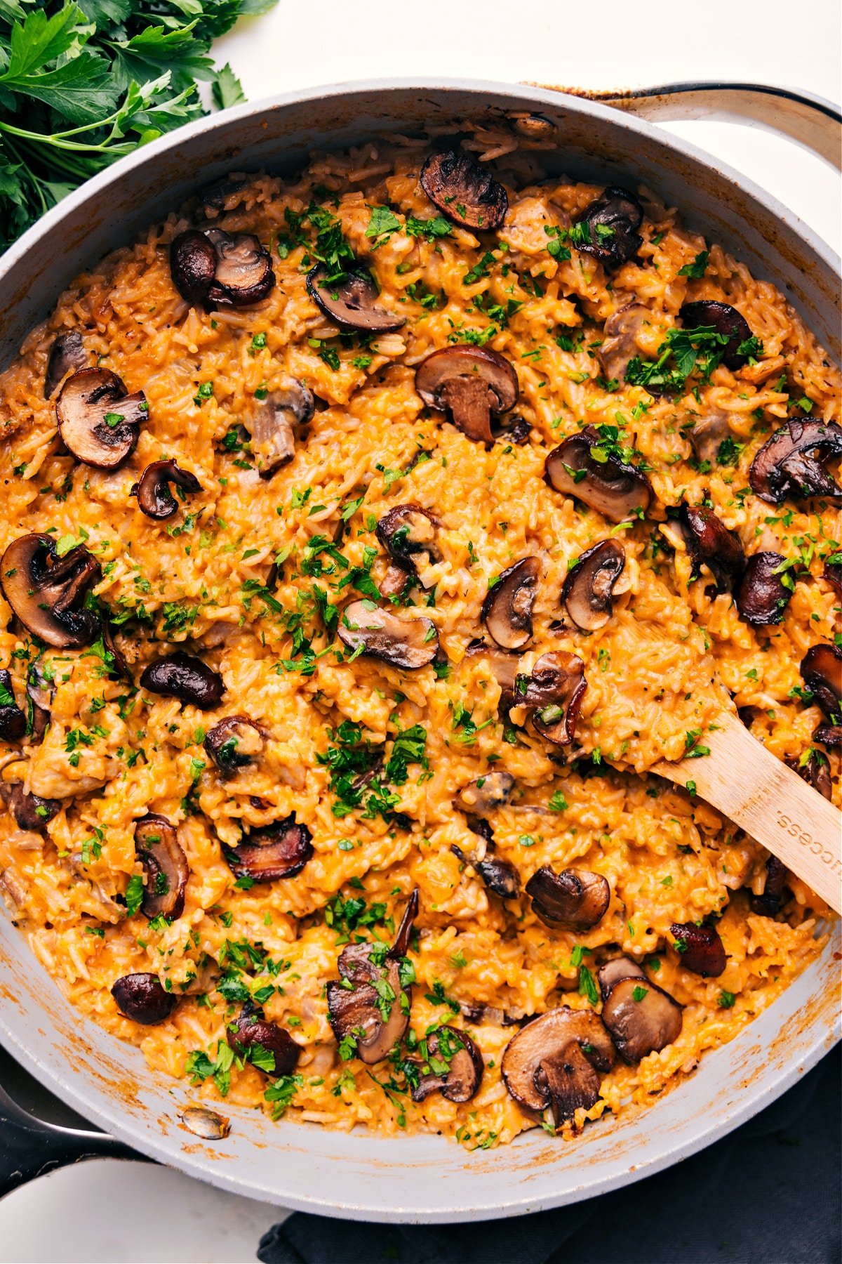 Smothered Chicken and Rice in a skillet, hot and ready to serve.