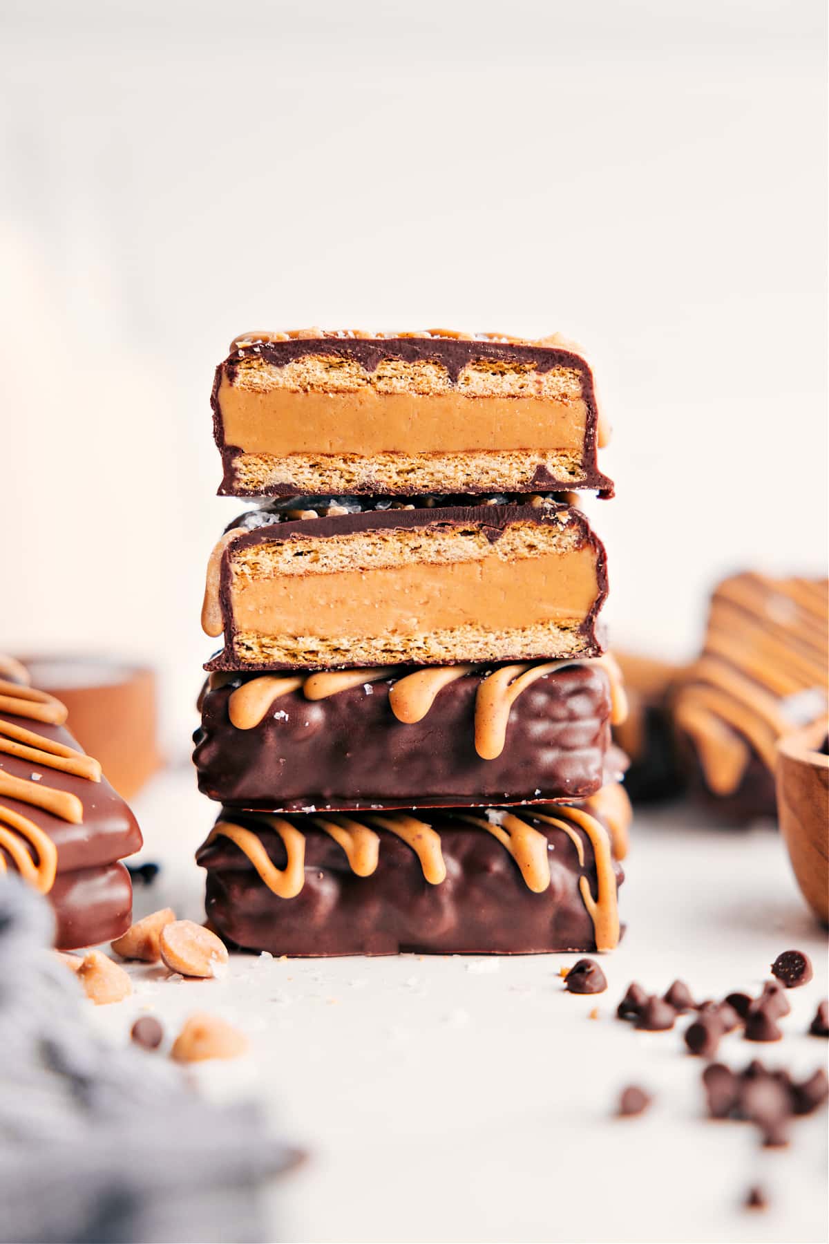 Stack of Buckeye Graham Crackers with one broken open showing creamy peanut butter filling.