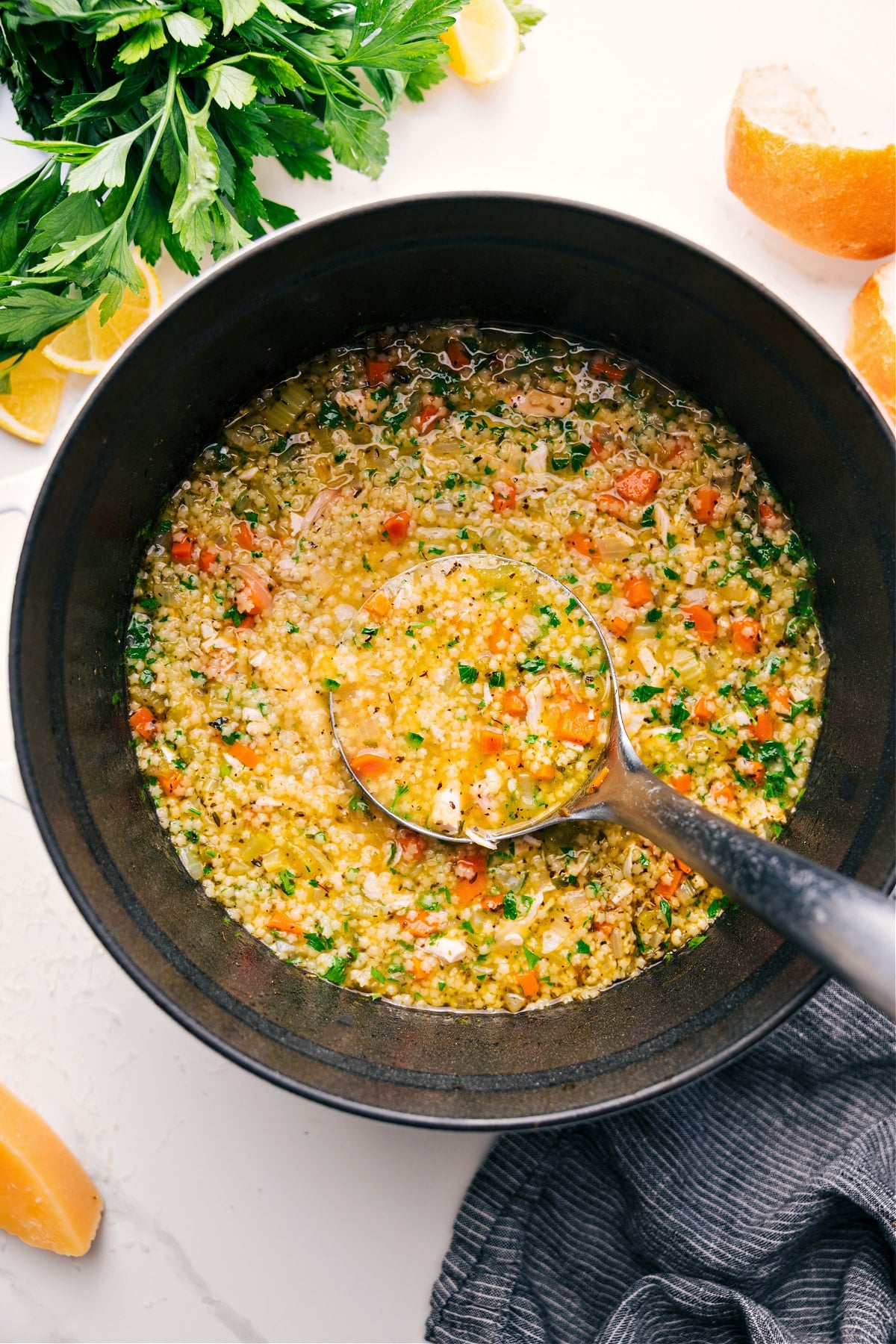 A Big Bowl Of This Roasted Carrot Salad Pastina Soup with tiny pasta, tender vegetables, and a drizzle of olive oil in a bowl.