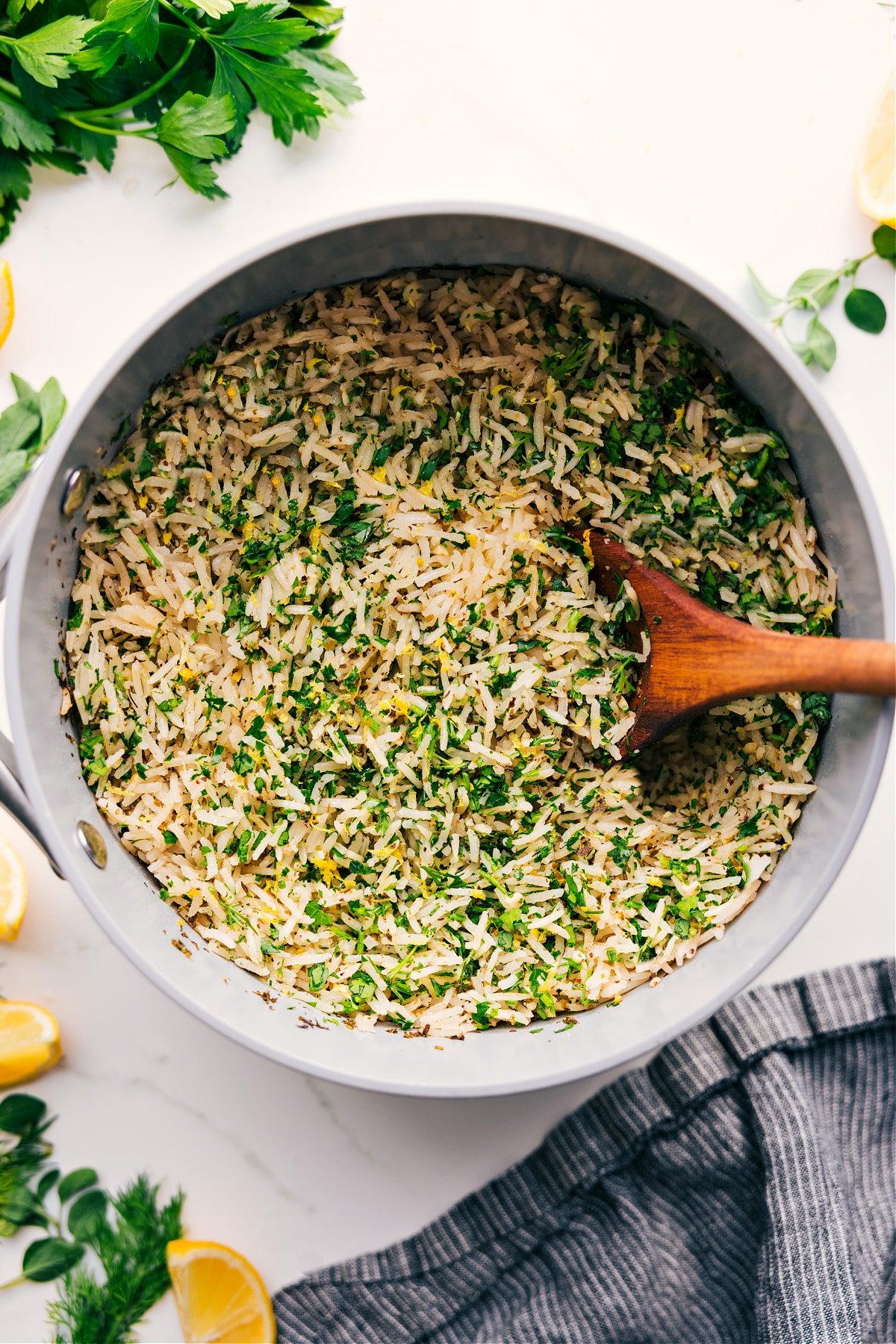 The Best Side To Any Dish: Greek Rice Greek Rice Recipe in the pot with fresh lemon zest and parsley through out it.