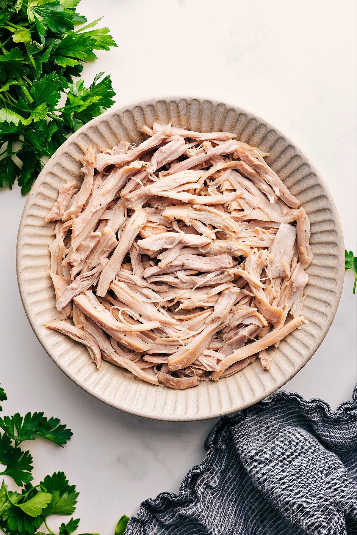 Shredded Chicken Recipes That Everyone Loves Shredded Chicken Recipes in a bowl ready to be enjoyed or used in another dish.