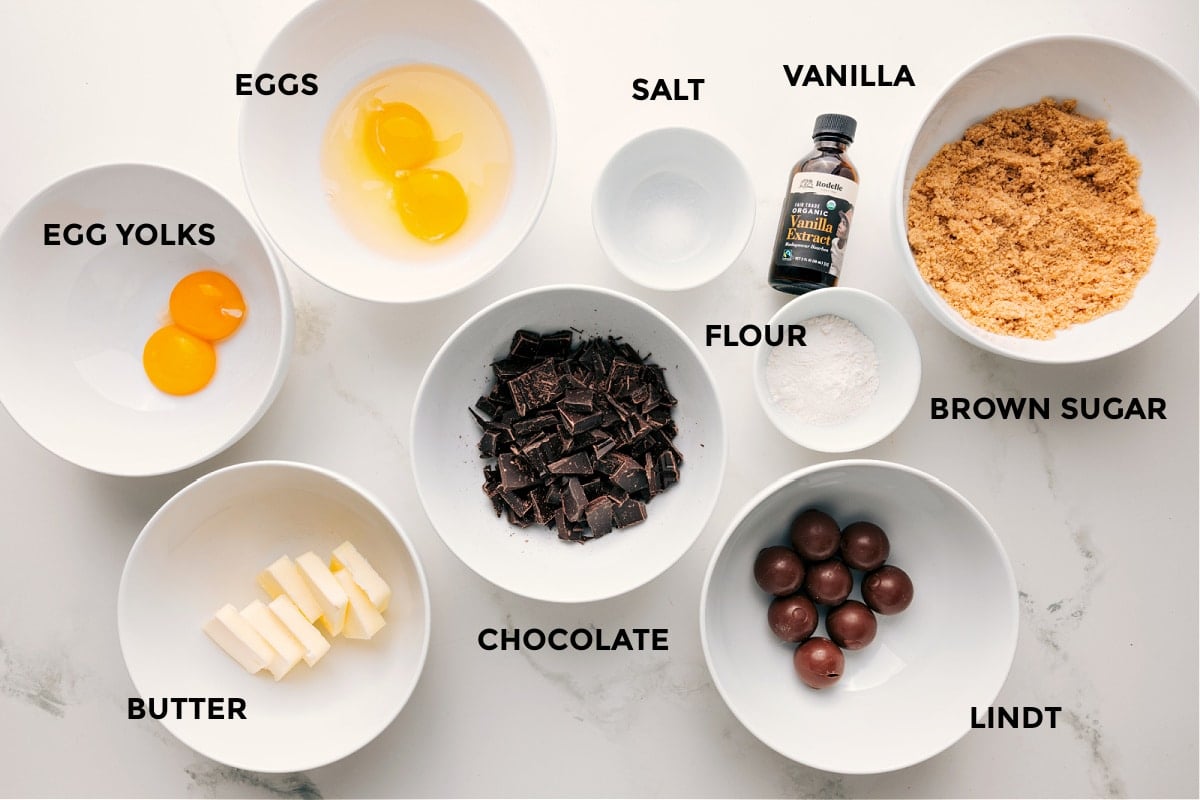 Ingredients In Chilis Lava Cake All the ingredients in this recipe prepped out for easy assembly including the egg yolks, butter, eggs, chocolate, salt, flour, vanilla, and brown sugar.