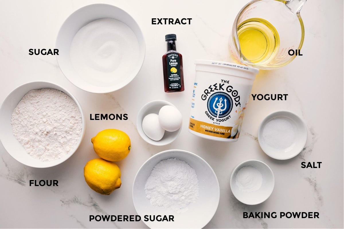 Ingredients In This Lemon Bread Recipe All the ingredients in this recipe prepped out for easy assembly including the flour, sugar, extract, lemons, powdered sugar, baking powder, salt, yogurt, and oil.