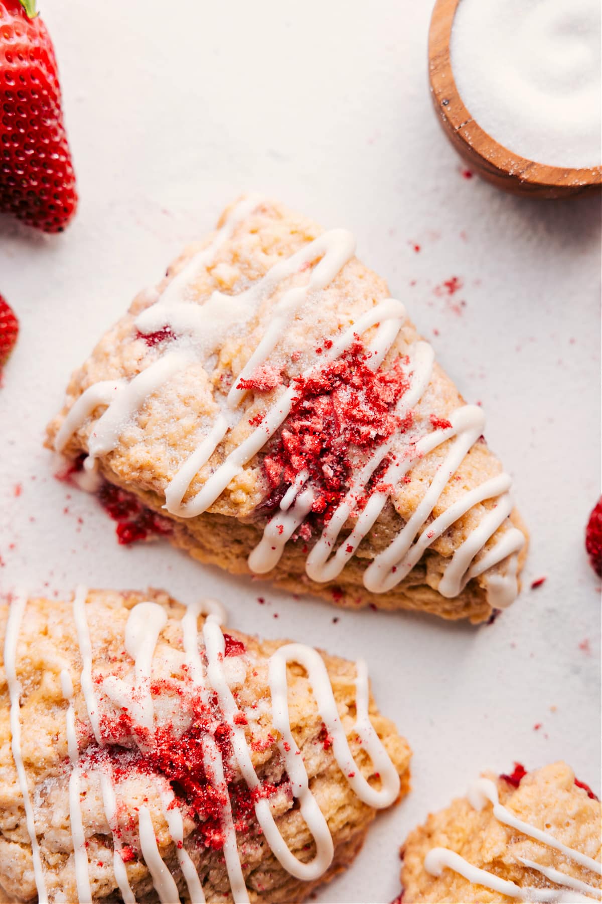 These Strawberry Scones Are The Perfect Way To Start Your Day Strawberry scones recipe topped with a sweet glaze and crushed strawberries.