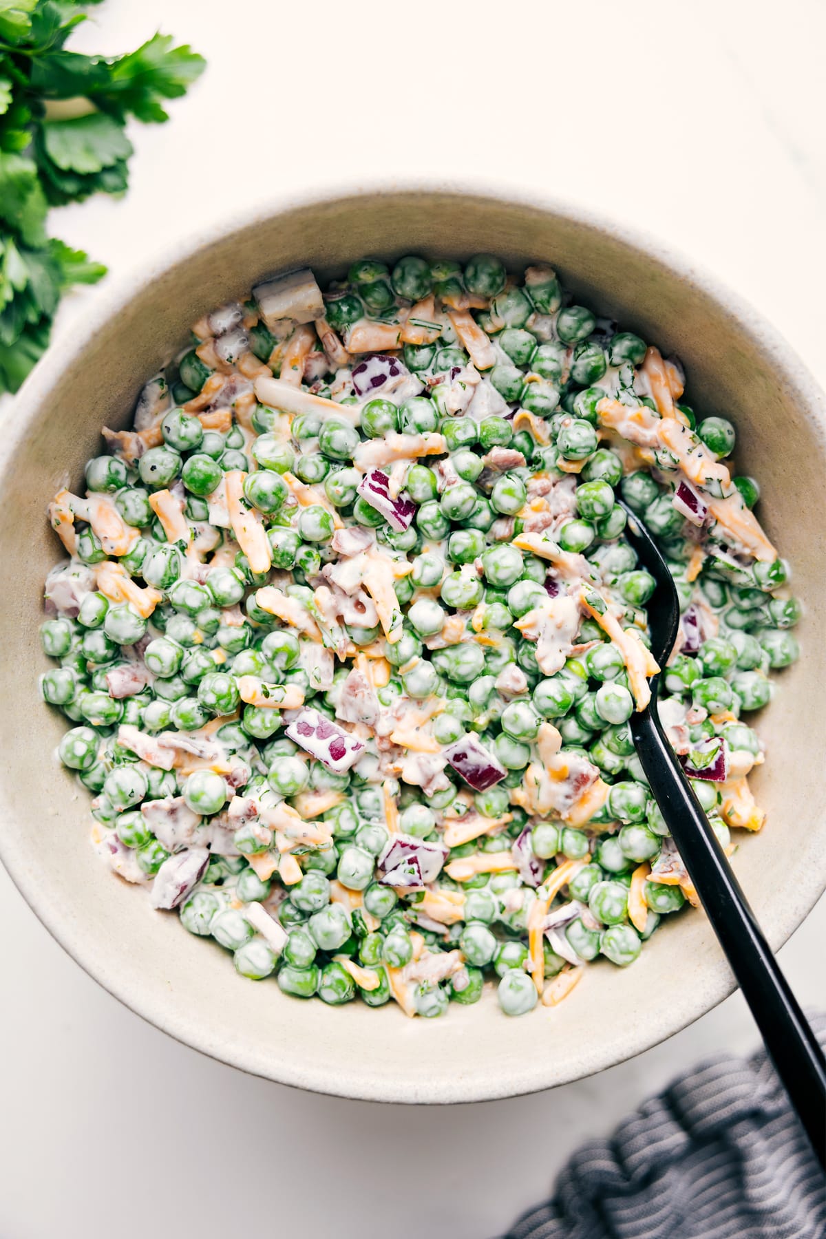 Pea Salad Recipe tossed together and coated in creamy dressing, ready to enjoy.