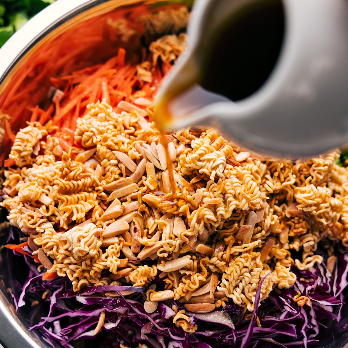Crunchy And Flavorful Ramen Noodle Salad Recipe All the ingredients in this ramen noodle salad recipe added to a bowl and tossed with the dressing.