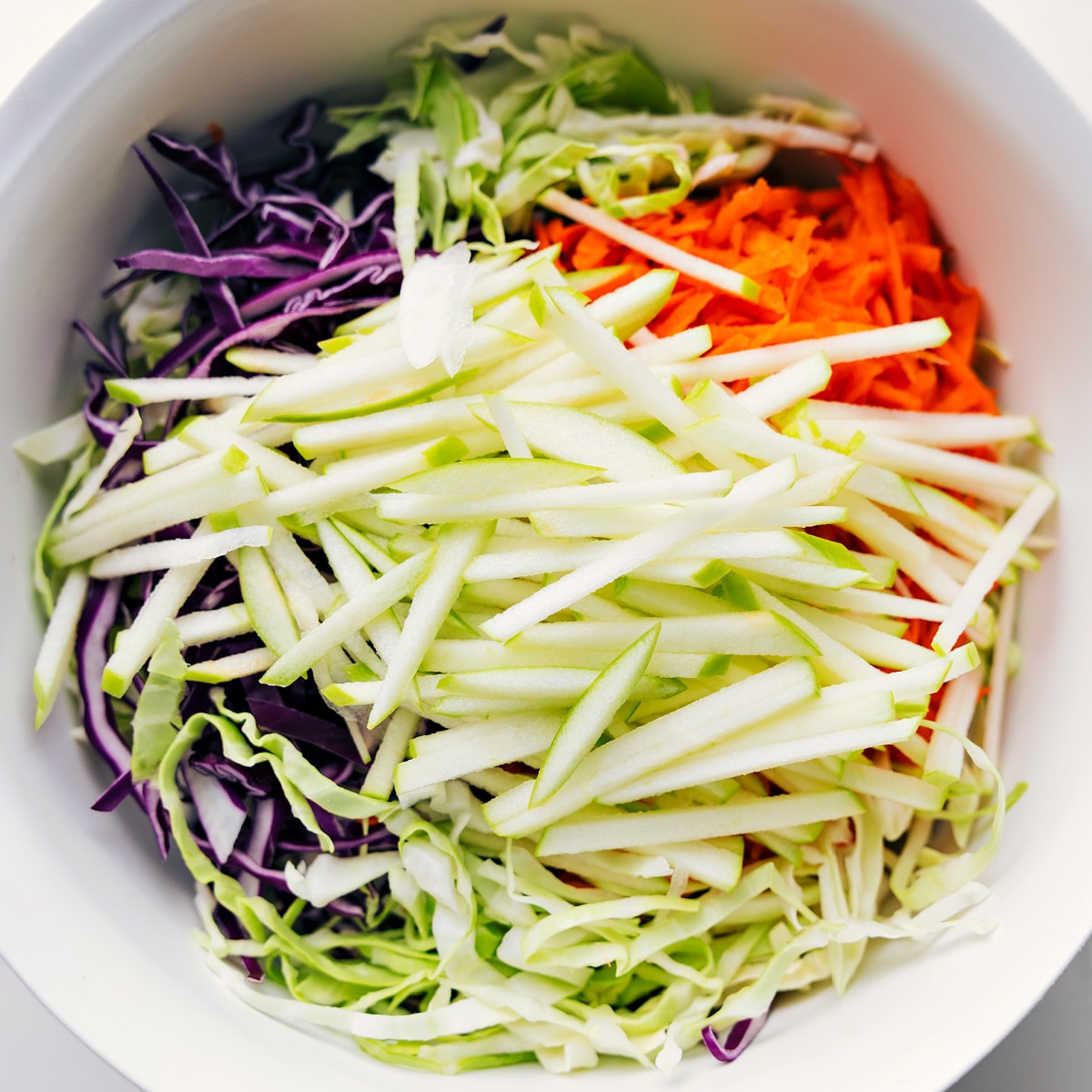 Assembling The Easy Coleslaw Recipe Base ingredients for the Easy Coleslaw Recipe added to a bowl.