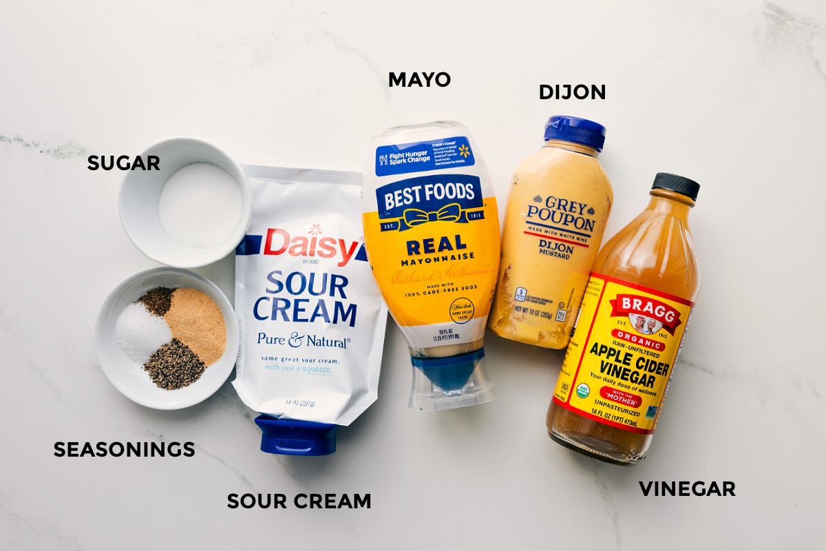 How To Make The Best Dressing For This Macaroni Salad Recipe All the ingredients for the dressing in this macaroni salad recipe prepped out for easy assembly including the mayo, dijon, apple cider vinegar, seasonings, and sugar.