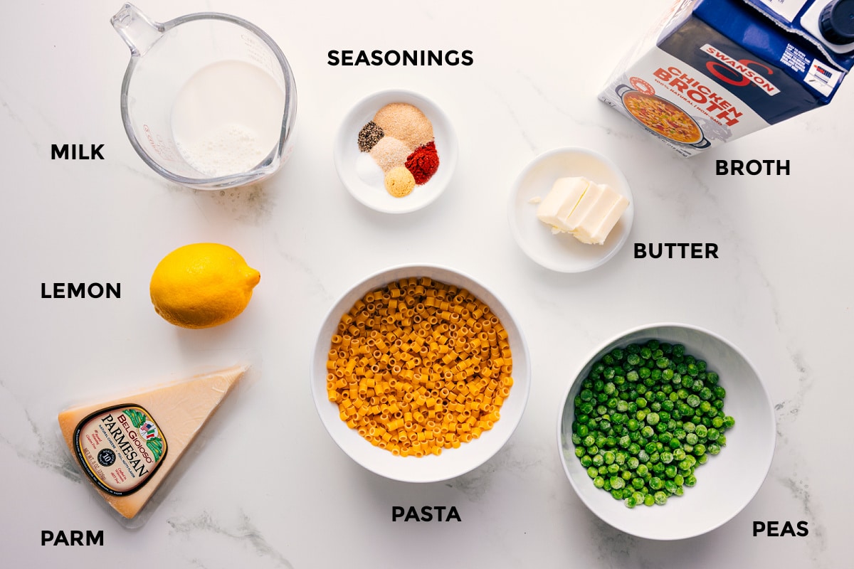 Ingredients In Peas With Pasta All the ingredients in this recipe prepped out for easy assembly including the milk, lemon, parm, seasonings, pasta, peas, butter, and broth.