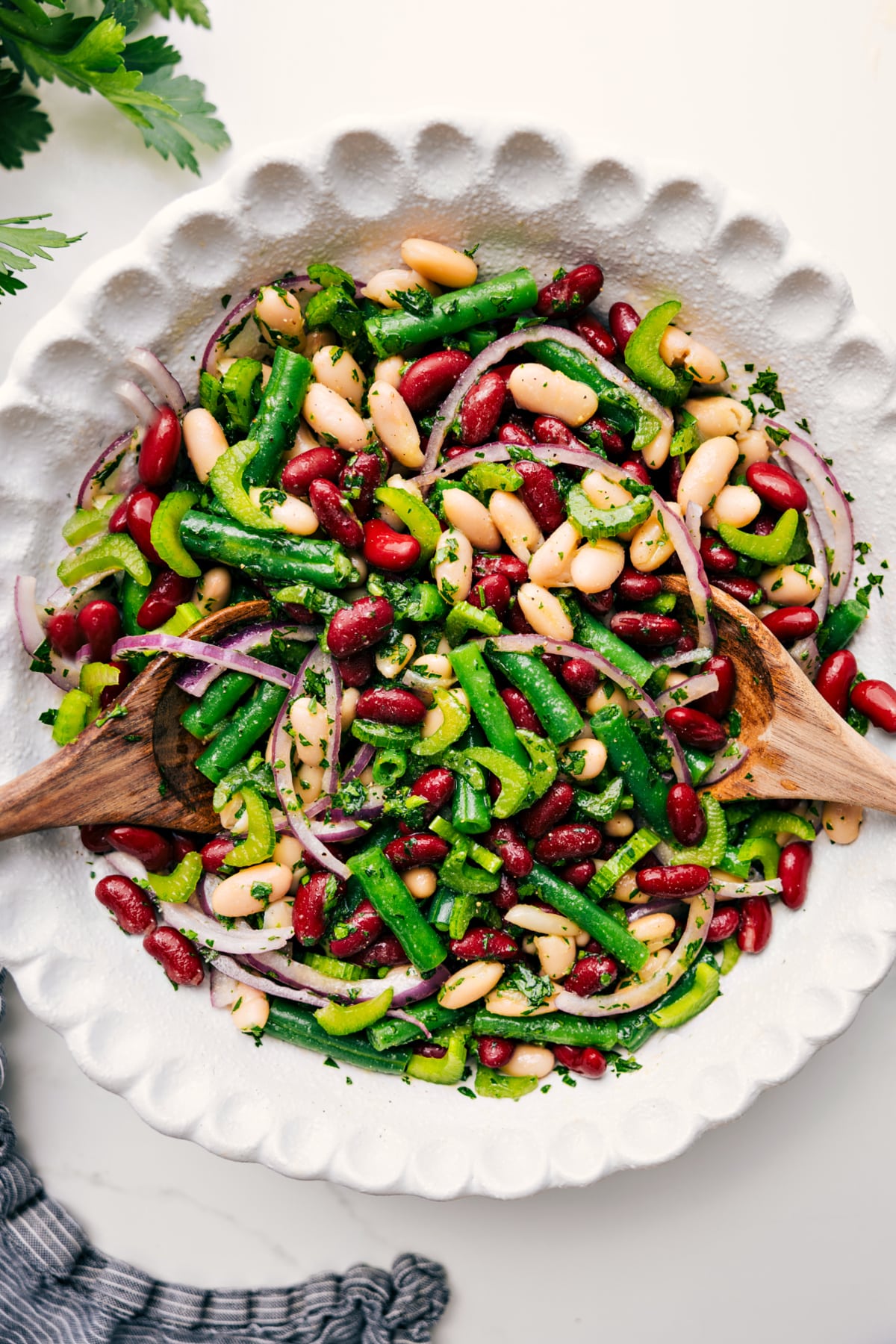 Three Bean Salad Recipe Three bean salad tossed with dressing in a bowl, ready to serve.