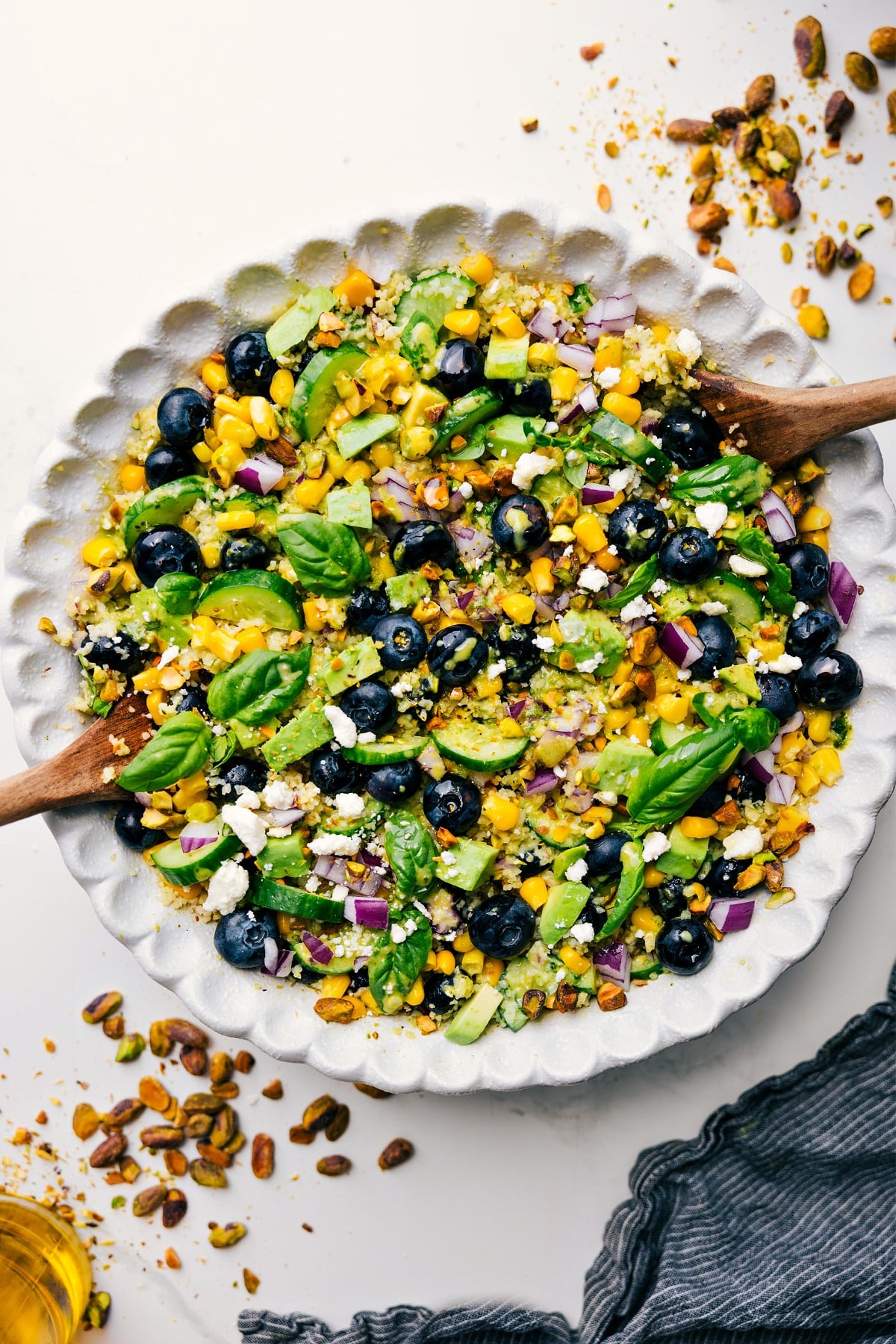 Fresh And Flavorful Blueberry Salad Blueberry salad tossed with dressing in a large serving bowl.