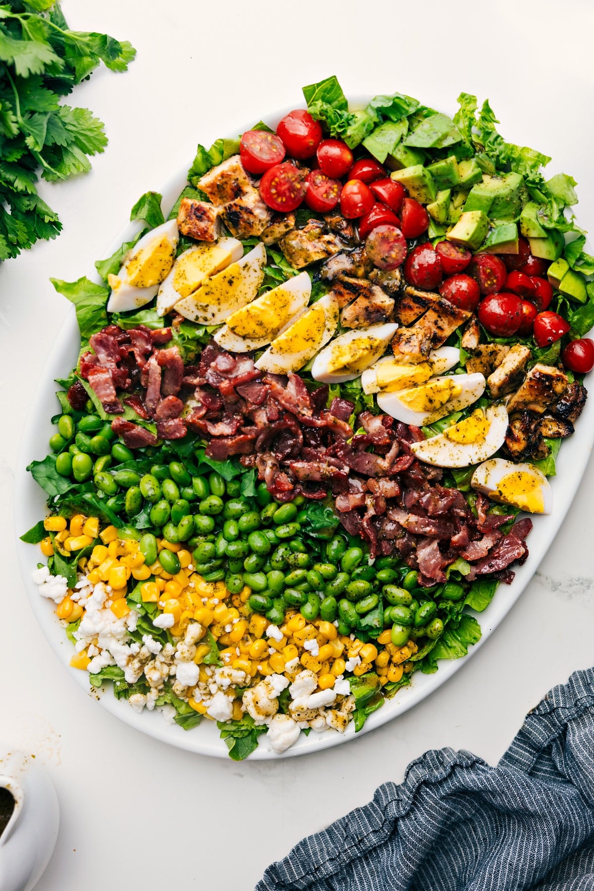 Fresh And Flavorful Cobb Salad Recipe Cobb Salad Recipe served on a platter, dressed and ready to enjoy.