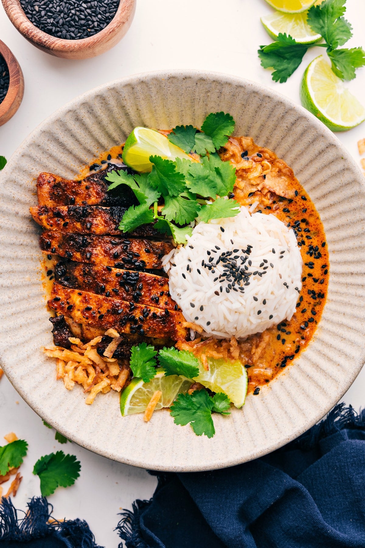 Chili-Garlic Broth Bowls with chicken, rice, cilantro, crispy fried onions, and sesame seeds.